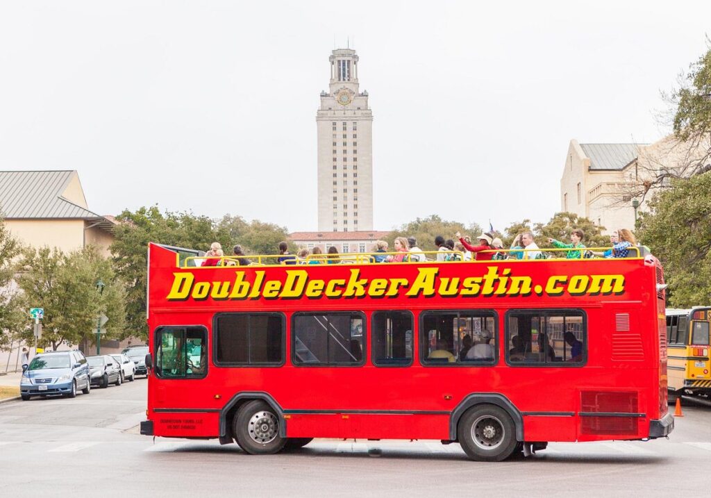 Red Tour Bus for Double Decker Austin driving around 35 guest to sight see Austin's local attractions and sights.